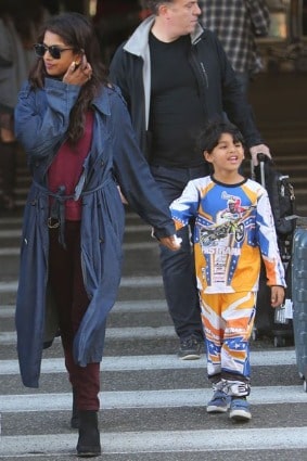 He is wearing full tee and jogger with mixed color that is blue, white and orange.